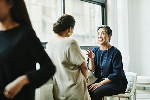 Business women in conversation