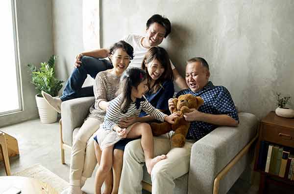 family sitting on couch